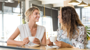 women discussing ovarian cancer risks and warning signs over coffee